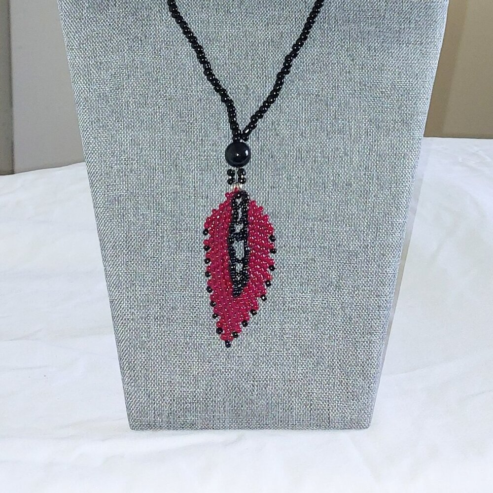 26" beaded necklace with beaded petal pendant